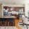 a kitchen with a dining table and chairs
