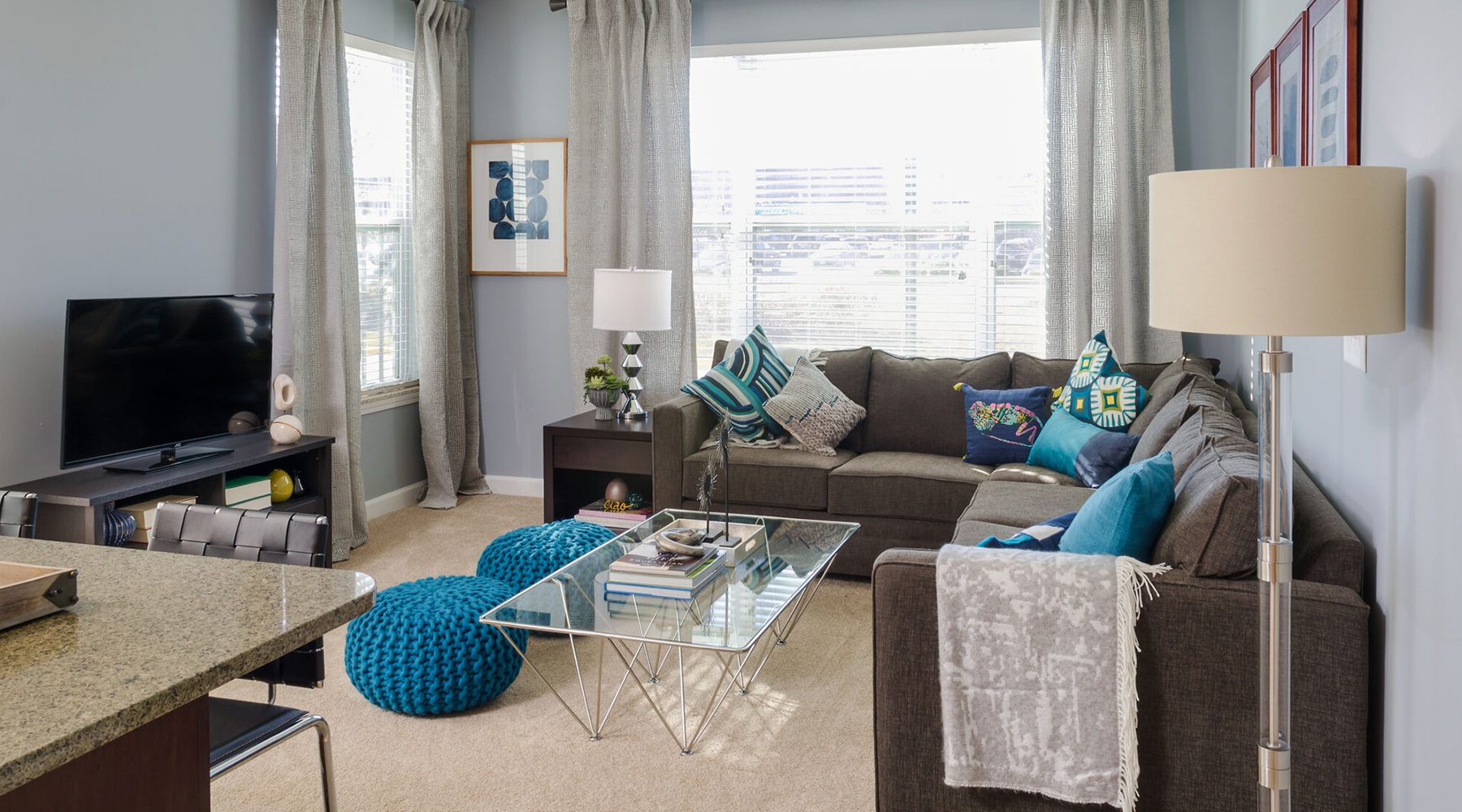 Generous living spaces to relax and unwind living room with tv couch and coffee table