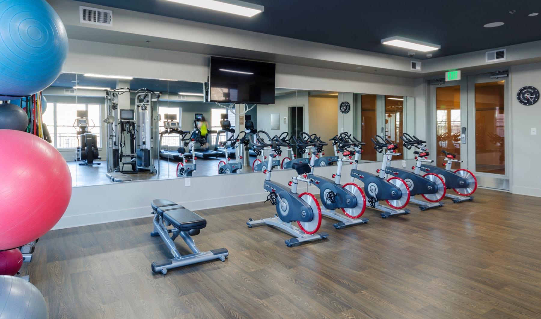 Cutting-edge amenities at your fingertips a gym with exercise equipment
