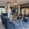 a room with chairs and a chandelier