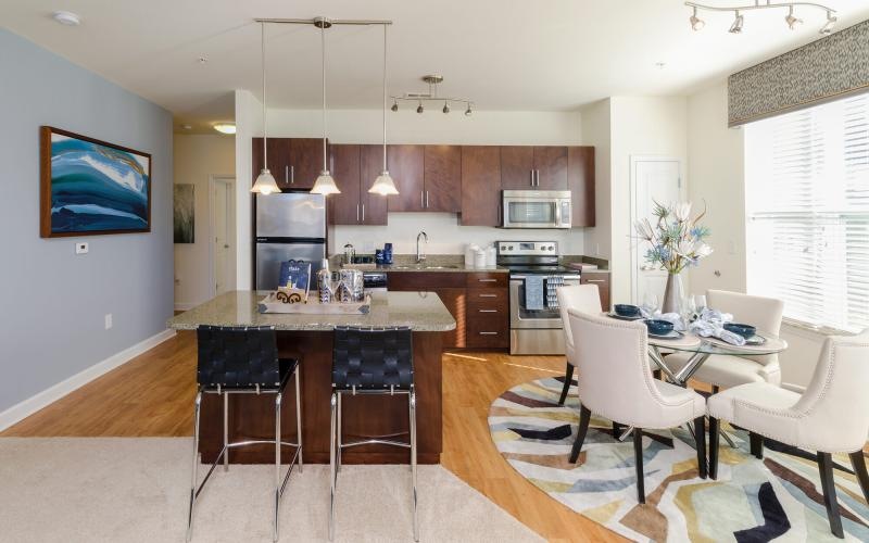 a kitchen with a dining table and chairs