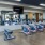 The fitness center at Victor Stonebridge Apartments in Woodbridge, featuring wood grain floor paneling and exercise bikes.